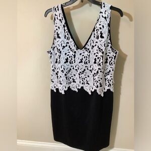 Black sleeveless dress with white appliqué overlay on front,back zip Ptp 22 1/2”